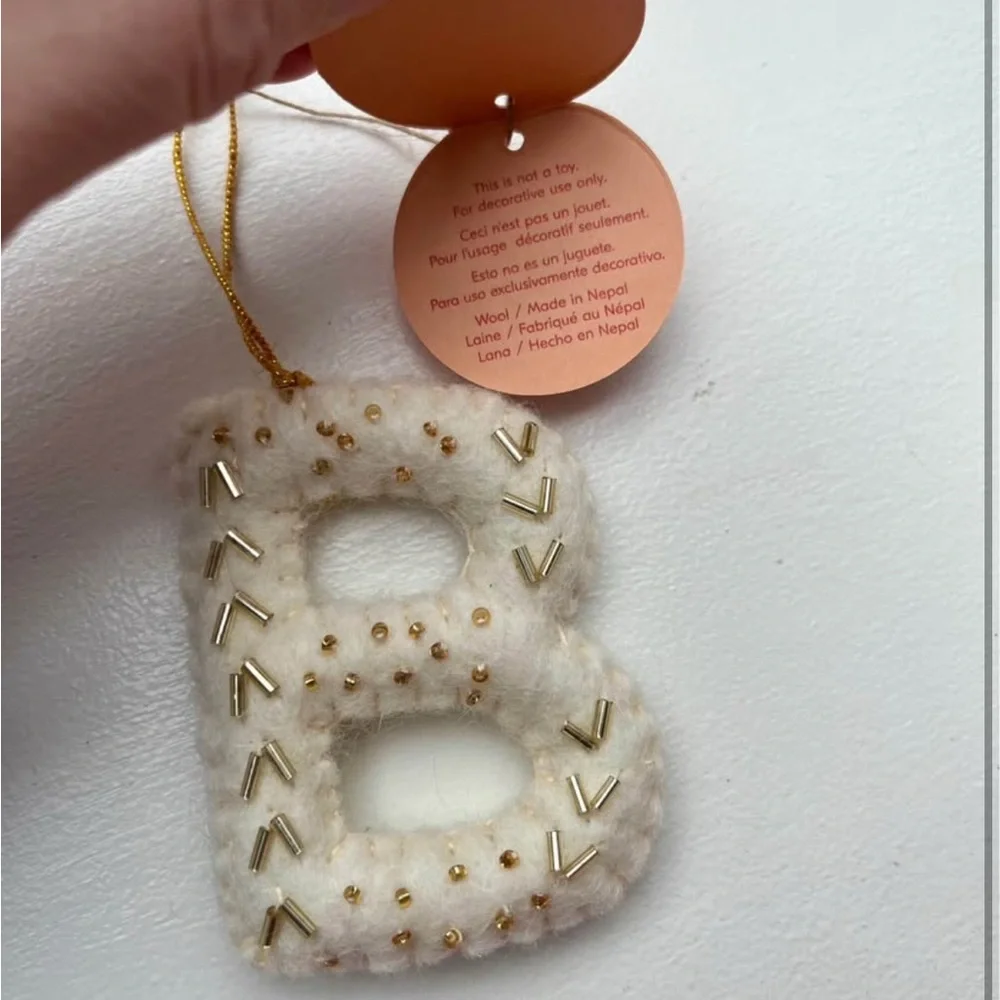 ONE * West Elm Handcrafted Wool Cream Holiday Ornament Message for which Letter